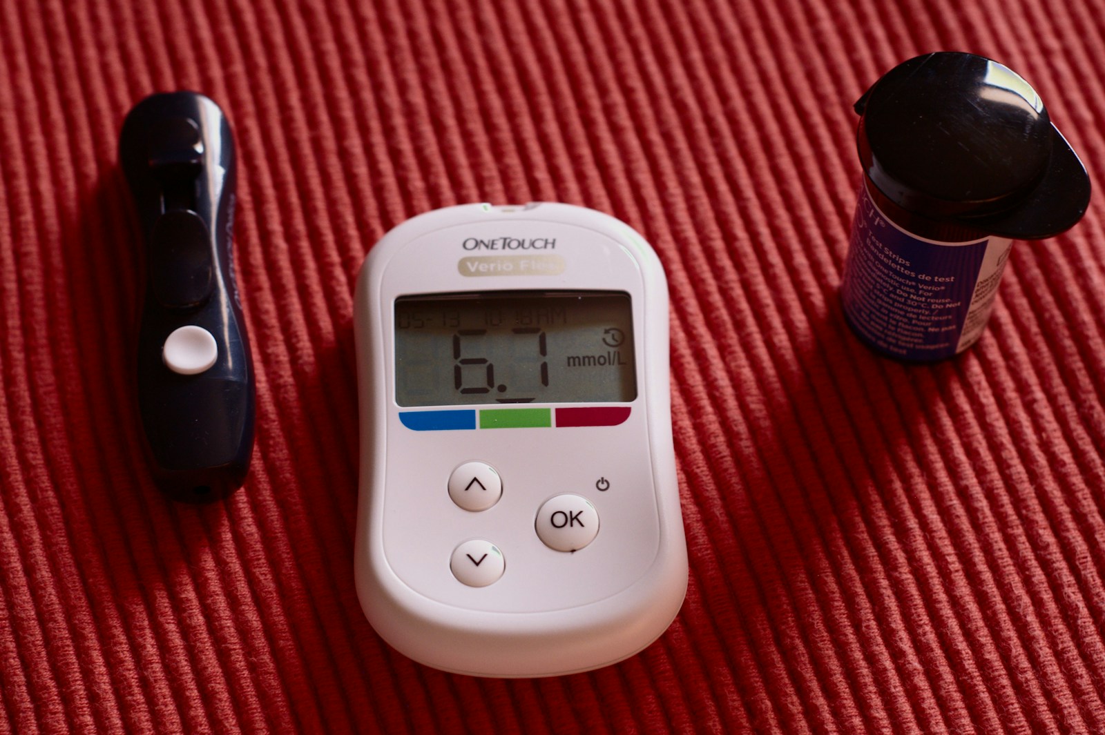 Glucose meter showing a blood sugar reading, illustrating the link between diabetes and bladder function