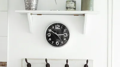 Round wall clock showing the time, a reminder to track how many times you pee a day